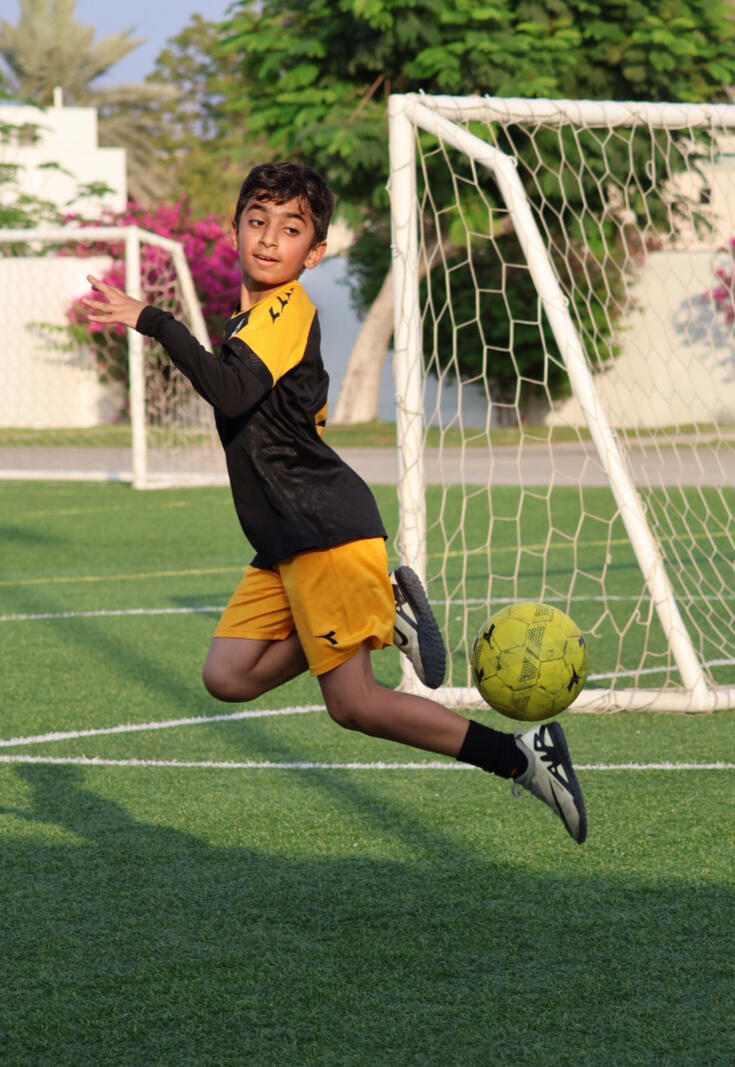 Skills by a boy at Elite Football Academy in Seeb