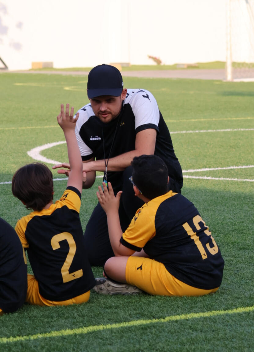 Coach at Elite Football Academy In Seeb Talking To Kids